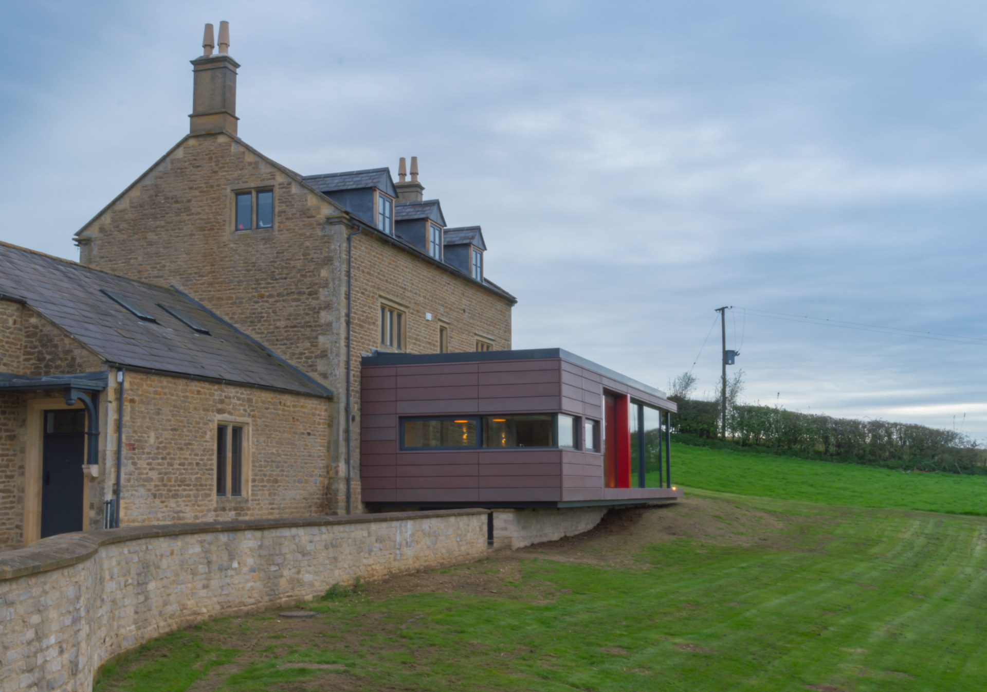 a modern house extension to a country farmhouse